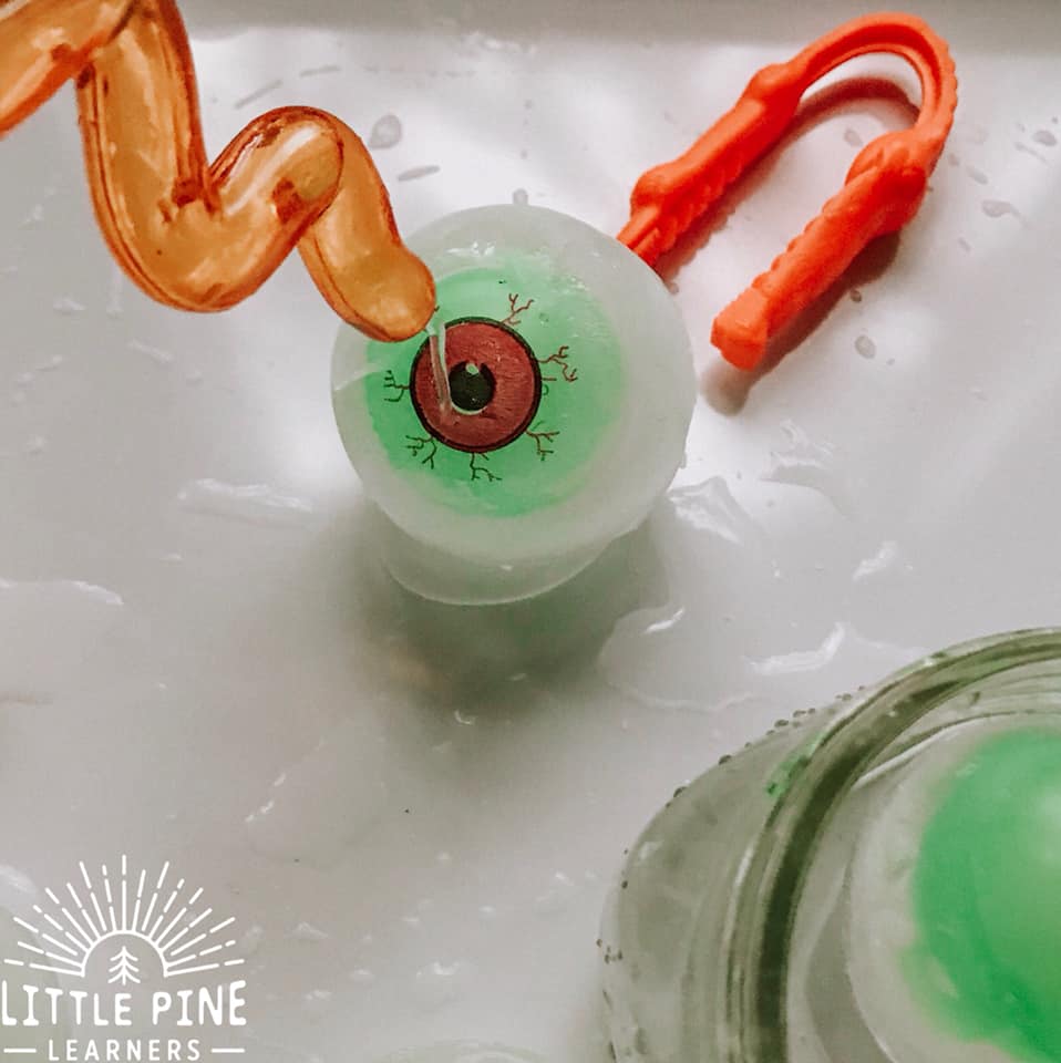 This icy sensory bin is perfect for your next Halloween party or any regular ole Monday! It's easy to set up and it will keep kids entertained for a long time. Just freeze toy monster eyeballs in extra large sphere ice molds, set out some fine motor tools and you're all set!