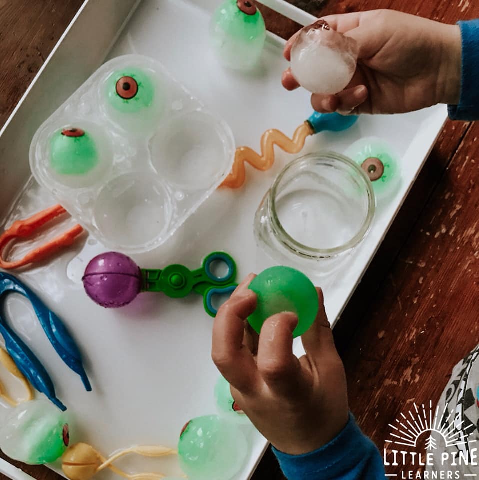 This icy sensory bin is perfect for your next Halloween party or any regular ole Monday! It's easy to set up and it will keep kids entertained for a long time. Just freeze toy monster eyeballs in extra large sphere ice molds, set out some fine motor tools and you're all set!