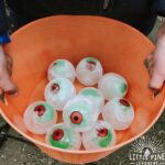 This icy sensory bin is perfect for your next Halloween party or any regular ole Monday! It's easy to set up and it will keep kids entertained for a long time. Just freeze toy monster eyeballs in extra large sphere ice molds, set out some fine motor tools and you are all set!