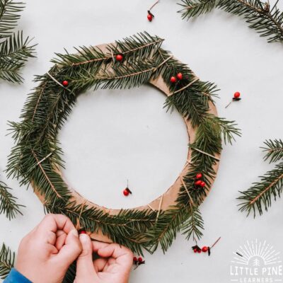 Try making this simple and adorable Christmas wreath for kids with real pine branches and cardboard!