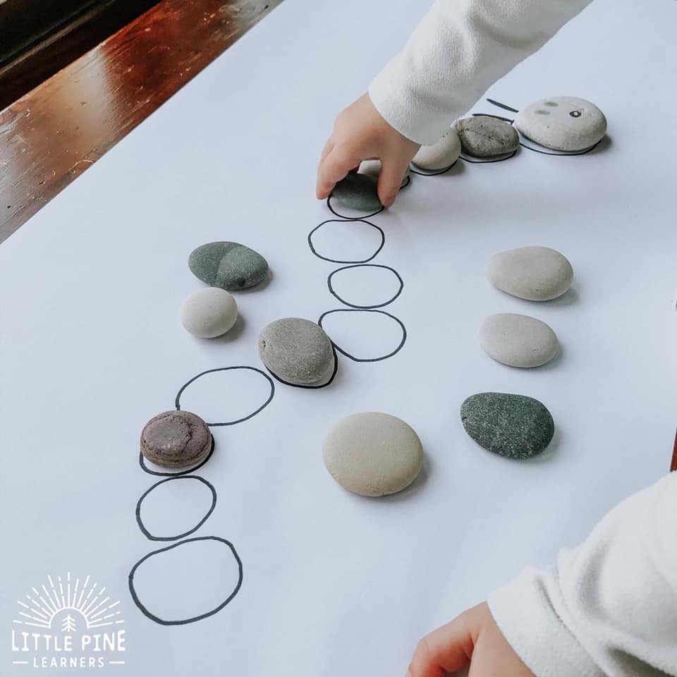 Here is a great stone activity for kids! This is the perfect spring game for kids and makes a great extension activity for The Very Hungry Caterpillar. Kids will enjoy searching for the correct stones while learning new nature vocabulary words, strengthening fine motor skills, and comparing different stone sizes and shapes.    