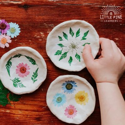 Try making these pretty pinch pots with flowers and leaves!